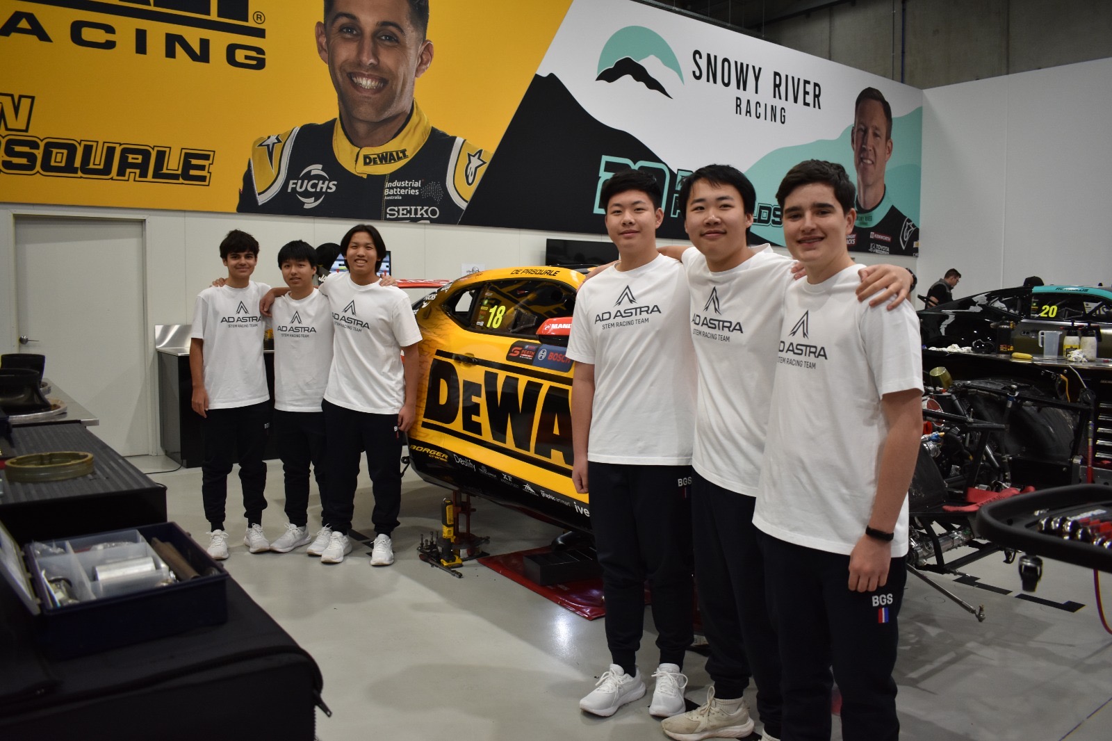 Ad Astra team members beside the Team18|DeWalt Chevrolet Supercar